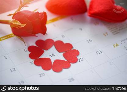 Valentines day calendar love time concept / Calendar page with red heart on February 14 of Saint Valentine&rsquo;s day red heart and roses flower