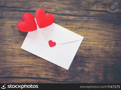 Valentines day card romantic / Envelope love mail Valentine Letter Card with Red Heart Love concept - Invitation card Wedding on wood background top view copy space