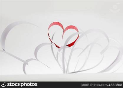Valentines day card with paper and ribbon hearts on white