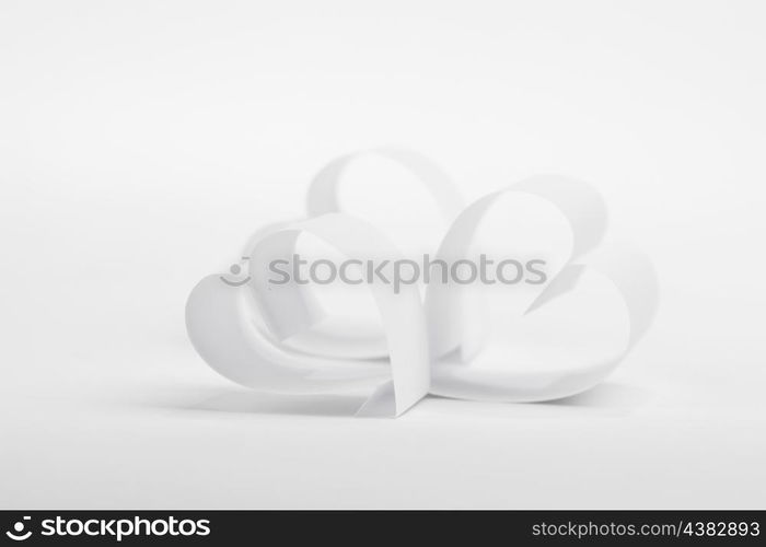 Valentines day card with paper white hearts on white