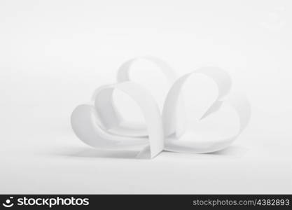 Valentines day card with paper white hearts on white