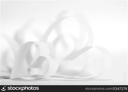 Valentines day card with paper white hearts on white