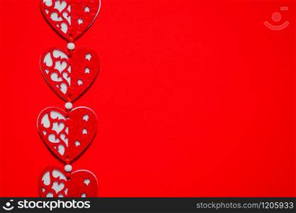Valentines day concept. Textile red hearts on a red background, place for text.. Valentines day concept. Textile red hearts on a red background.