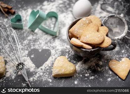 valentines day cookies with flour kitchen utensils