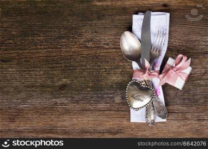 Valentines day dinner with vintage  cutlery and gift box. Valentines day dinner
