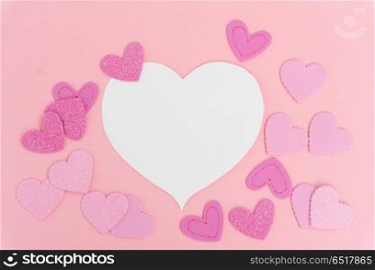 Valentines day frame. Valentines day frame with hearts on pink background with copy space