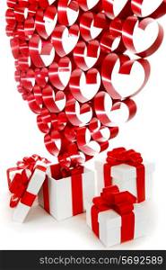 Valentines day gifts in white boxes with red ribbons and hearts isolated on white