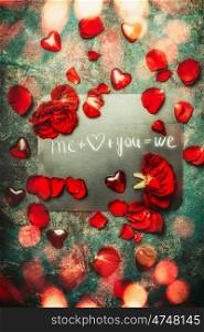 Valentines day greeting card with red roses , heart and text you and me we, top view composing. Love and dating concept