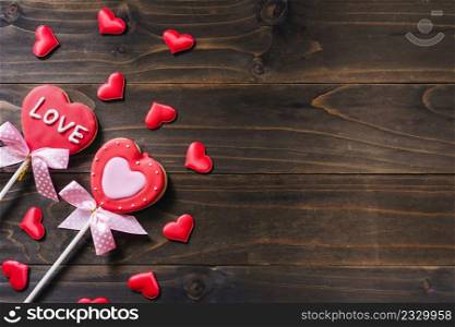 Valentines day heart shaped cookies on wooden table background with copy space.