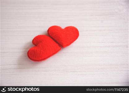 Valentines day love heart romantic concept / Couple red heart decorated on white wooden table background