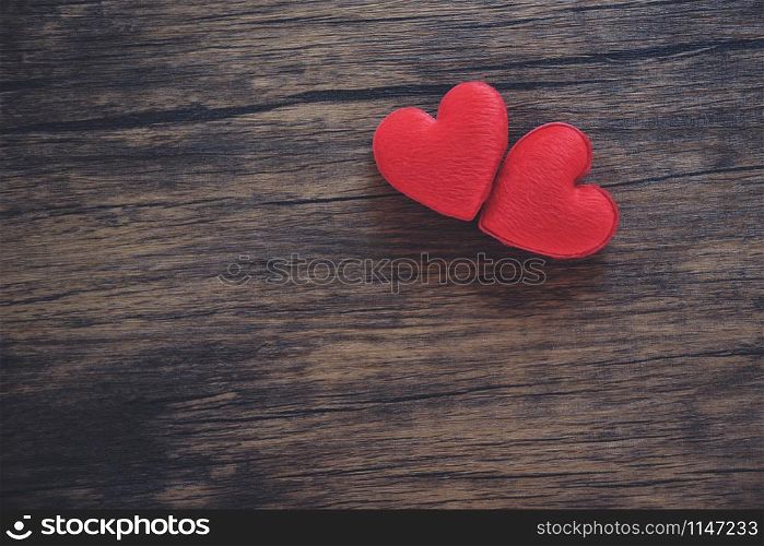 Valentines day love heart romantic concept / Couple red heart decorated on wooden rustic background