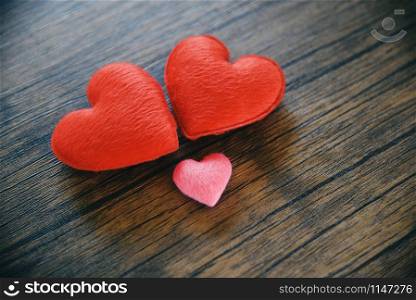 Valentines day love heart romantic concept / Red and pink heart decorated on wooden table rustic background