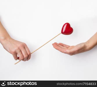 Valentines Day. Man presents palm with love sign symbol.. Man presents palm with love sign symbol.