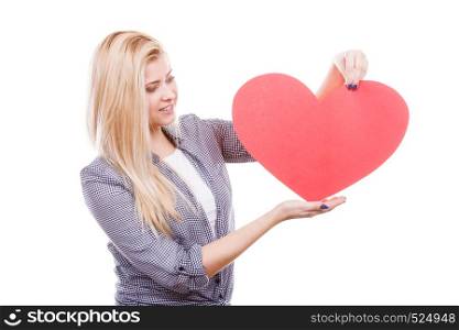 Valentines day, romance and relationship symbols concept. Woman holding big red heart, love sign.. Woman holding big red heart, love sign