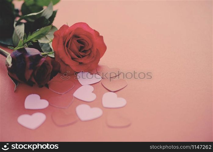 Valentines day romantic flower love concept / red roses flower and pink heart on red background copy space tone vintage