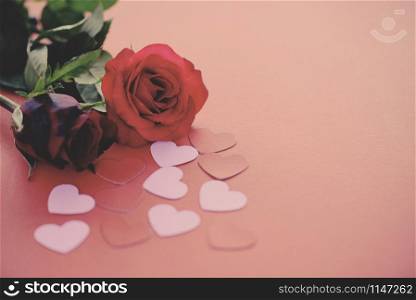 Valentines day romantic flower love concept / red roses flower and pink heart on red background copy space tone vintage