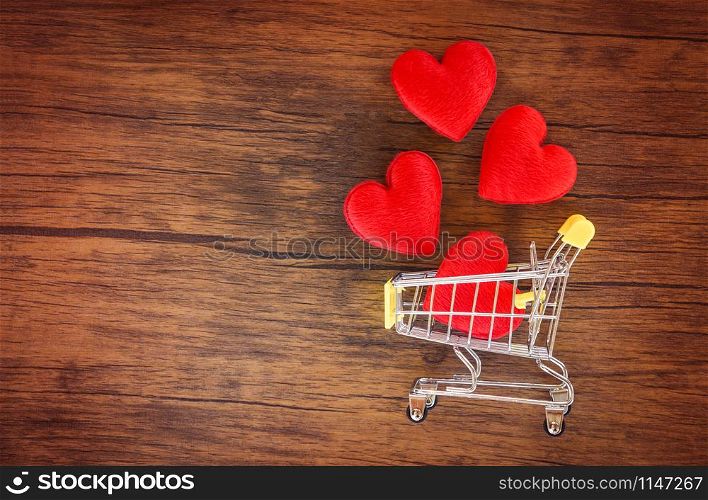 Valentines day shopping and red heart on shopping cart love concept / Shopping holiday for love Valentines day on wooden background tone vintage style top view copy space - Shopping vacation