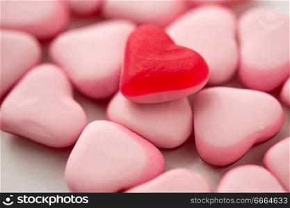 valentines day, sweets and confectionery concept - close up of red and pink heart shaped candies. close up of red and pink heart shaped candies
