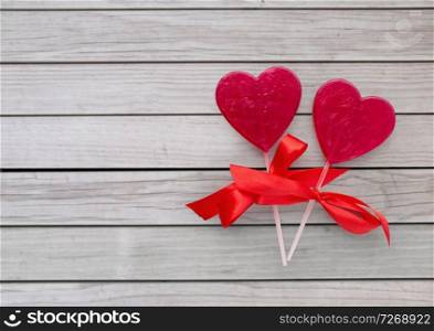 valentines day, sweets and romantic concept - red heart shaped lollipops on white background. red heart shaped lollipops for valentines day