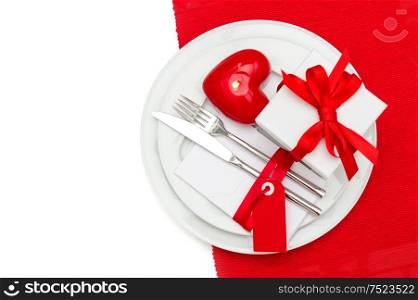 Valentines Day table place setting decoration in red and white. Romantic dinner. Selective focus