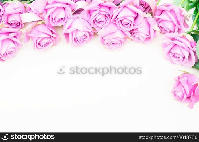 Valentines day violet roses top view flat lay border with heart and copy space. Valentines day violet roses
