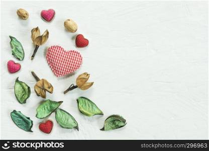 Valentines, love and wedding background concept. Red heart with decorated things on white wood texture table. Picture for add text message. Backdrop for design art work.
