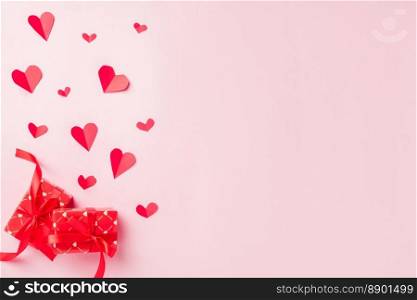 Valentines&rsquo; day background. Red gift box postcard and paper flying elements hearts cut greeting gift card isolated on pink background, Symbol of love. Top View Happy Mother&rsquo;s, Valentine&rsquo;s Day concept