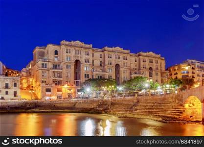 Valletta.. Embankment in the Bay Balluta.. The city embankment along the Baluta bay in the night illumination. Malta.
