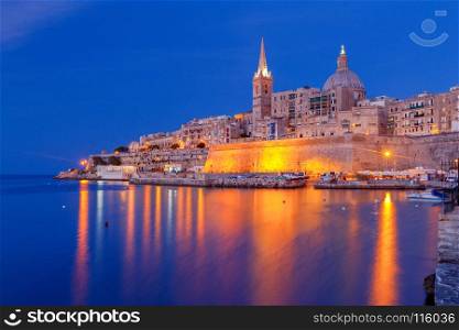 Valletta. Mediterranean harbor at night.. St. Paul's Cathedral in Valletta at sunset. Malta. Valletta