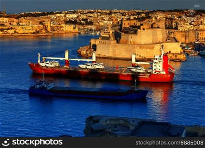 Valletta. Mediterranean harbor.. Mediterranean harbor In Valletta on the sunset. Malta.