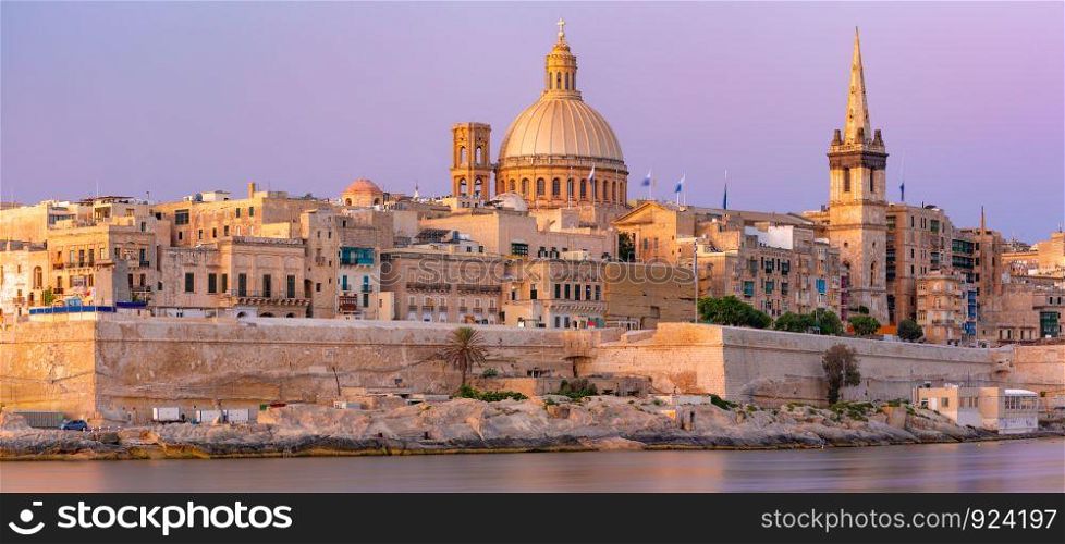 Valletta Skyline at beautiful sunset from Sliema with churches of Our Lady of Mount Carmel and St. Paul's Anglican Pro-Cathedral, Valletta, Capital city of Malta. Valletta Skyline from Sliema at sunset, Malta
