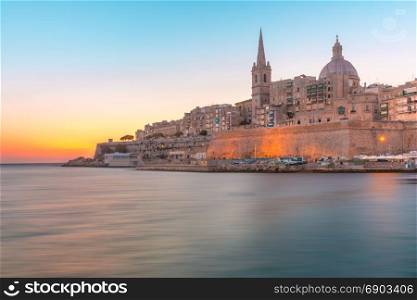 Valletta Skyline at the dawn, Malta. Valletta Skyline with churche of Our Lady of Mount Carmel and St. Paul&rsquo;s Anglican Pro-Cathedral, at dawn, Valletta, Capital city of Malta
