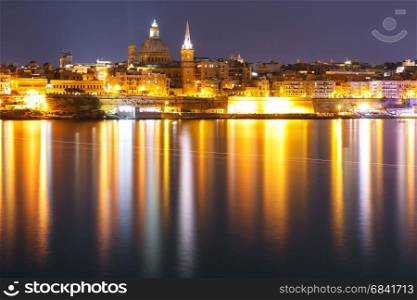 Valletta Skyline from Sliema at night, Malta. Valletta Skylineat at night from Sliema with church of Our Lady of Mount Carmel and St. Paul&rsquo;s Anglican Pro-Cathedral, Valletta, Capital city of Malta