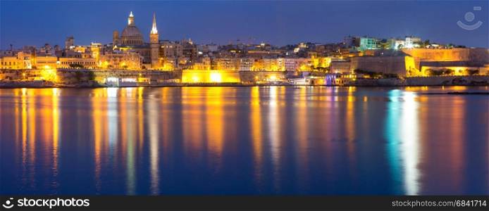 Valletta Skyline from Sliema at night, Malta. Valletta Skylineat at night with church of Our Lady of Mount Carmel and St. Paul&rsquo;s Anglican Pro-Cathedral, Valletta, Capital city of Malta. Panoramic view from Sliema.