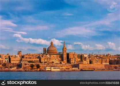 Valletta Skyline from Sliema at sunset, Malta. Valletta Skylineat at beautiful sunset from Sliema with churches of Our Lady of Mount Carmel and St. Paul&rsquo;s Anglican Pro-Cathedral, Valletta, Capital city of Malta