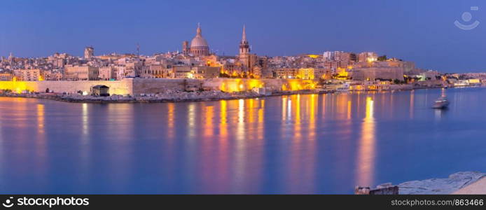Valletta Skyline with churches of Our Lady of Mount Carmel and St. Paul's Anglican Pro-Cathedral as seen from Sliema, Valletta, Capital city of Malta. Valletta Skyline from Sliema at sunset, Malta