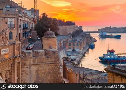Valletta Waterfront at dawn, Malta.. Lower Barrakka Gardens, Victoria gate and Valletta Waterfront at dawn, Malta.