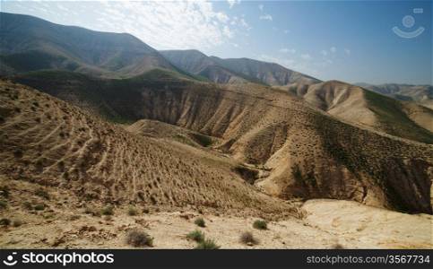 Valley between hills in desert in spring