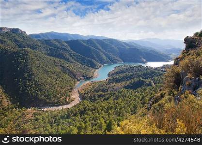 Valley with the river and cloudy sky in the Catalonian mountains
