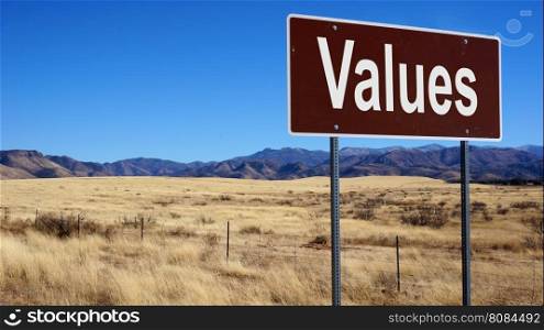 Values road sign with blue sky and wilderness