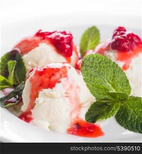 Vanill ice cream with strawberry jam and mint leaves