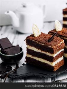 Vanilla and chocolate cake with chocolate slices