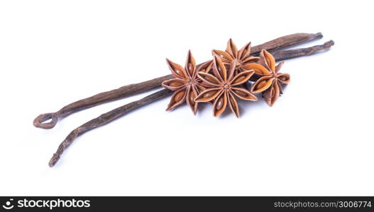 Vanilla bean and star anise on white background