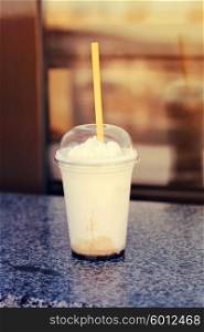 Vanilla frappe with plastic straw