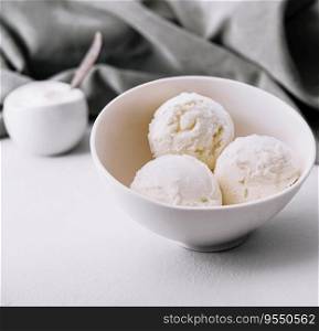 Vanilla ice cream balls in bowl
