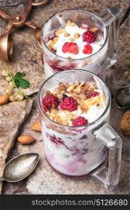 Vanilla ice cream with summer berries. Ice cream with raspberries and currants in a glass cup