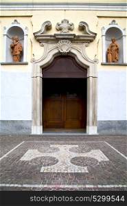 vanzaghello italy church varese the old door entrance and mosaic sunny daY rose window