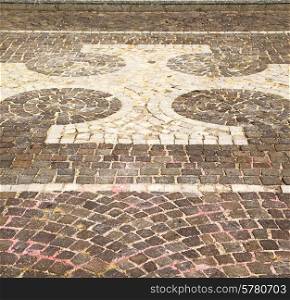 vanzaghello street lombardy italy varese abstract pavement of a curch and marble