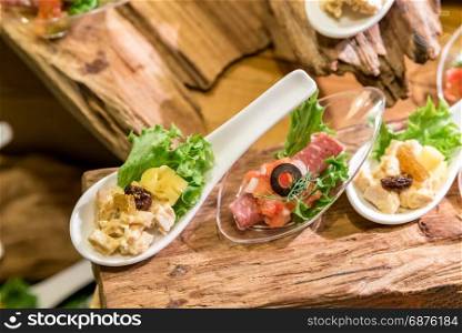 Vareity of canape on spoon