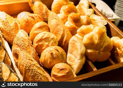 vareity of fresh bread in the wooden tray